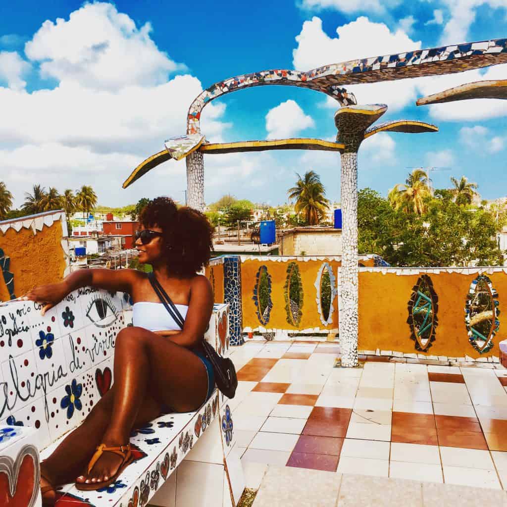 Woman sitting on bench at Fusterlandía