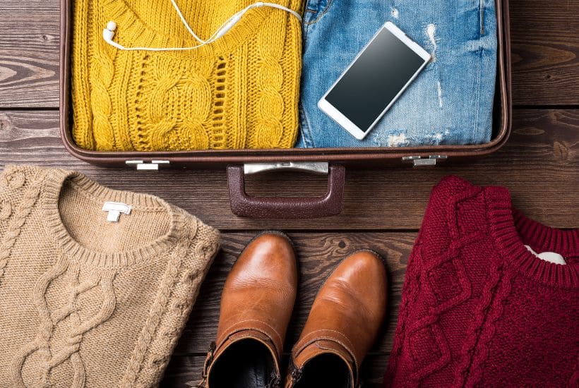 sweaters with suitcase; packing