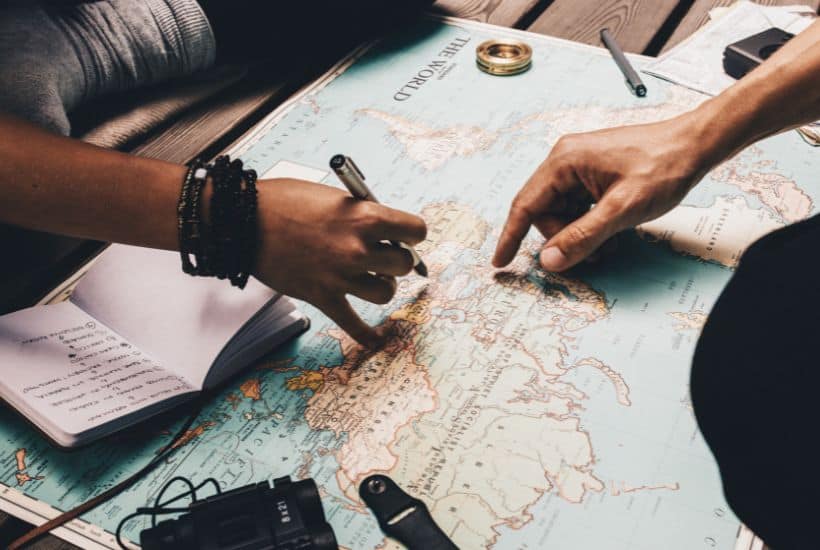how to plan a trip, people planning with a map