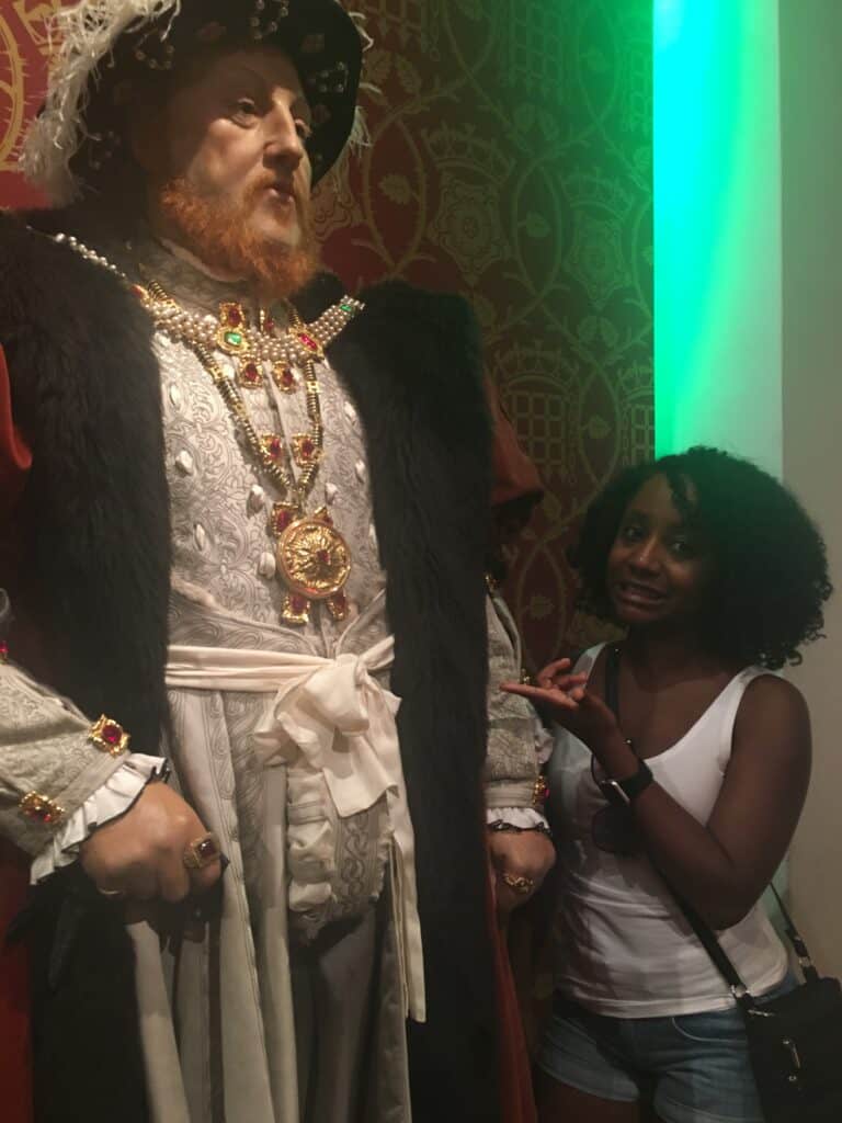 Black woman with Henry VIII at Madame Tussaud's